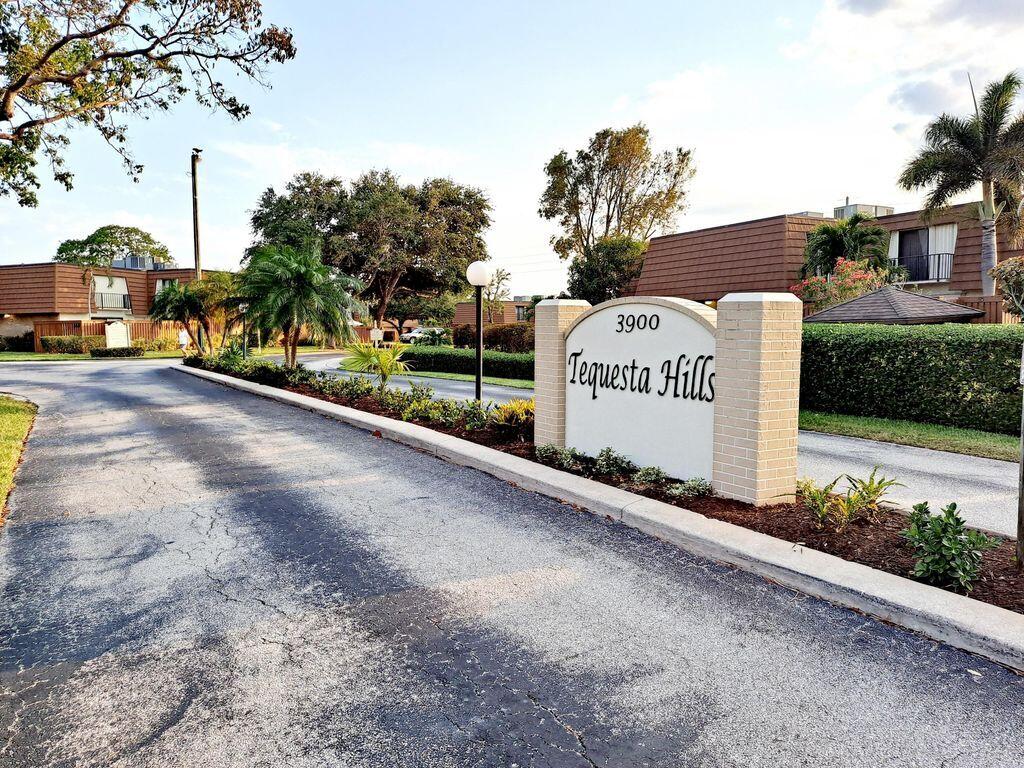 3900 County Line Road, Unit 16A Tequesta, FL 33469 - Photo 24 of 27 a sign on the side of a road