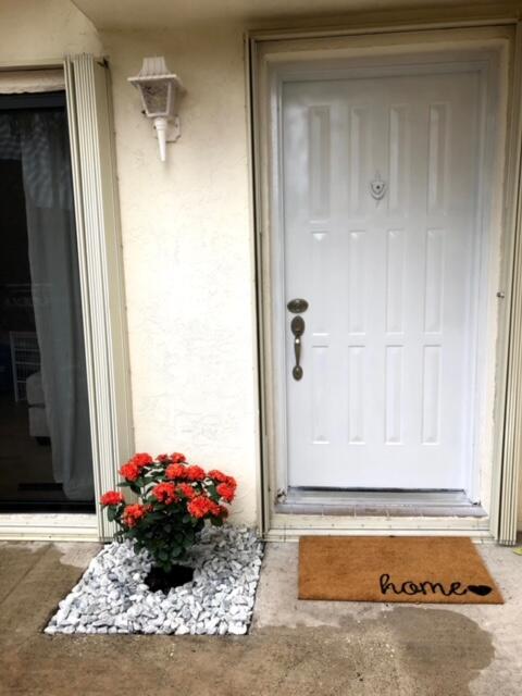 3900 County Line Road, Unit 16A Tequesta, FL 33469 - Photo 6 of 27 a view of a entryway door of the house
