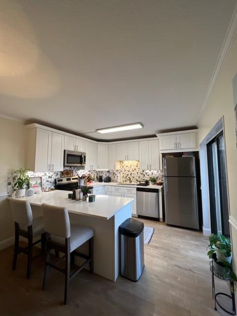3900 County Line Road, Unit 16A Tequesta, FL 33469 - Photo 8 of 27 a kitchen with a refrigerator and a stove top oven