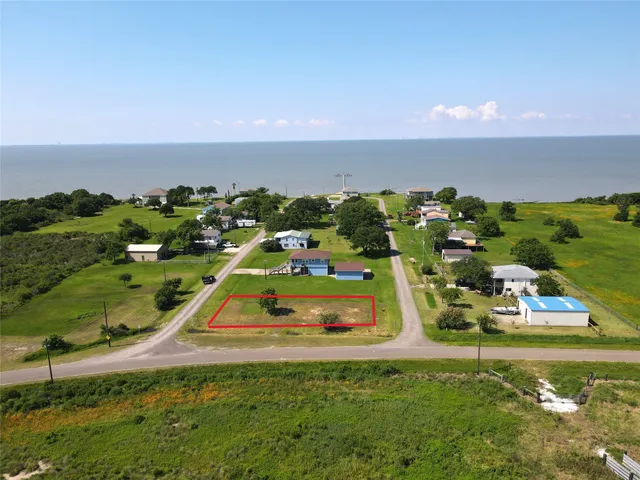 an aerial view of a residential houses with outdoor space and swimming pool