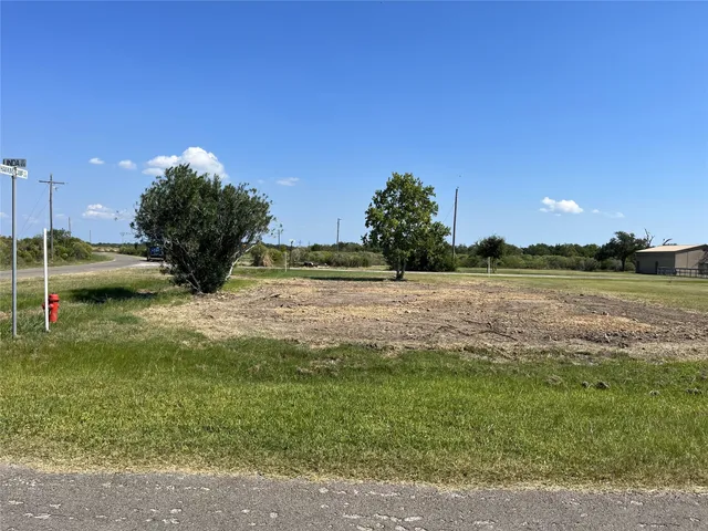 a view of a lake with a yard