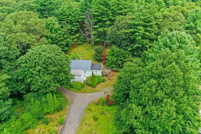 an aerial view of a house with a garden