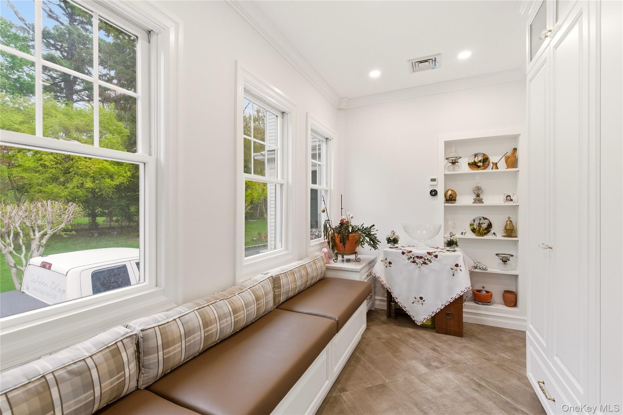 89 Duck Pond Road Glen Cove, NY 11542 - Photo 12 of 37 a living room with furniture and large windows