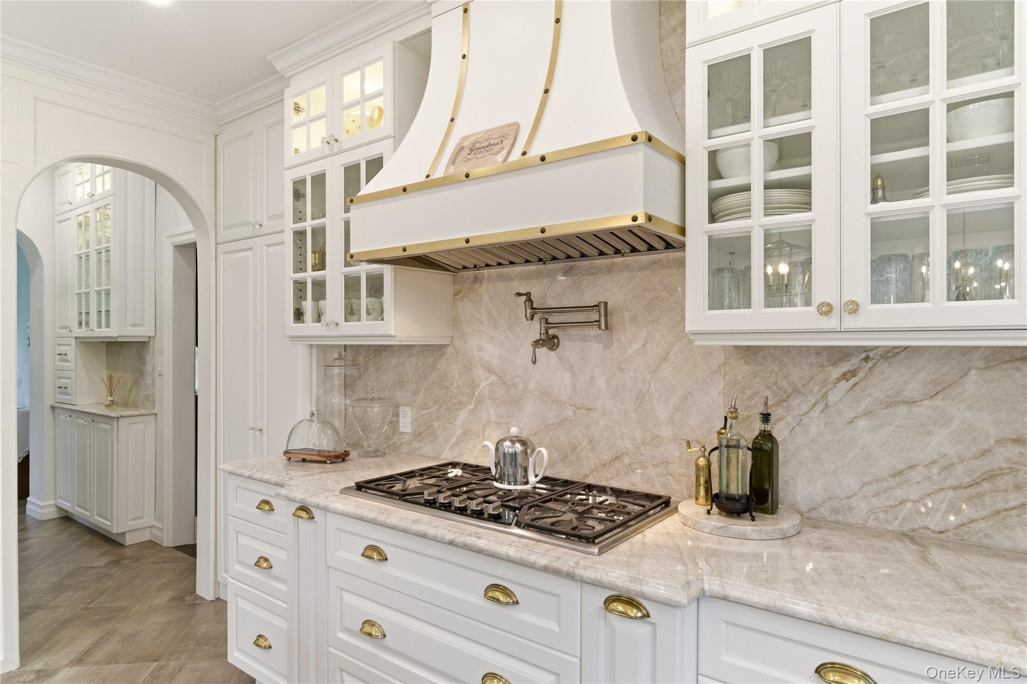 89 Duck Pond Road Glen Cove, NY 11542 - Photo 14 of 37 a kitchen with stainless steel appliances granite countertop a stove and a refrigerator