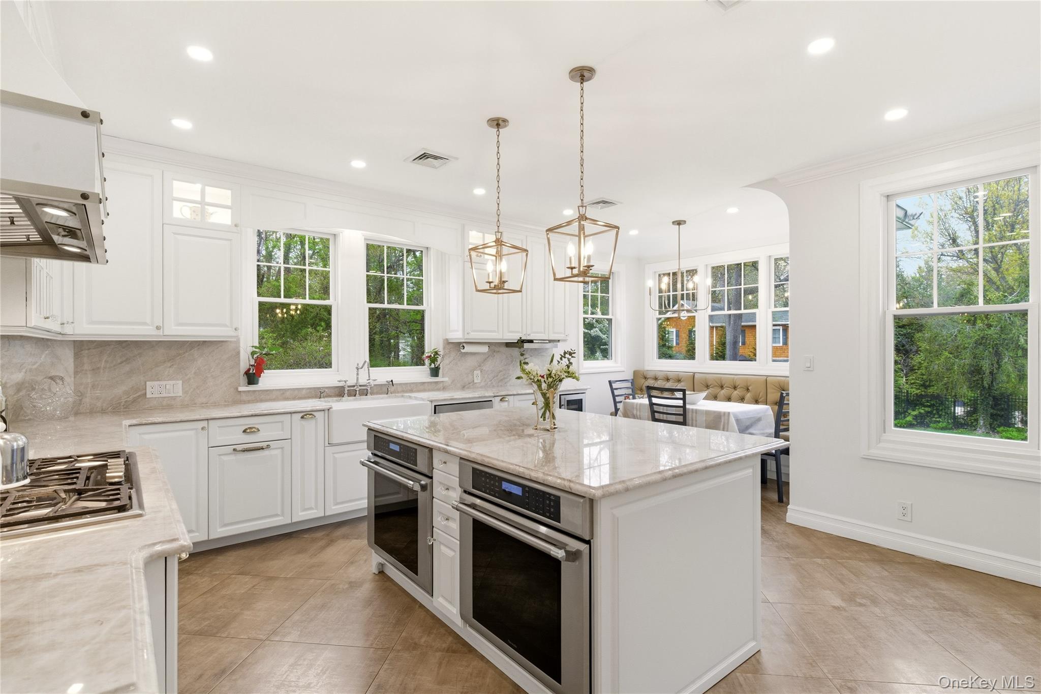 89 Duck Pond Road Glen Cove, NY 11542 - Photo 15 of 37 a kitchen with stainless steel appliances granite countertop a sink and stove