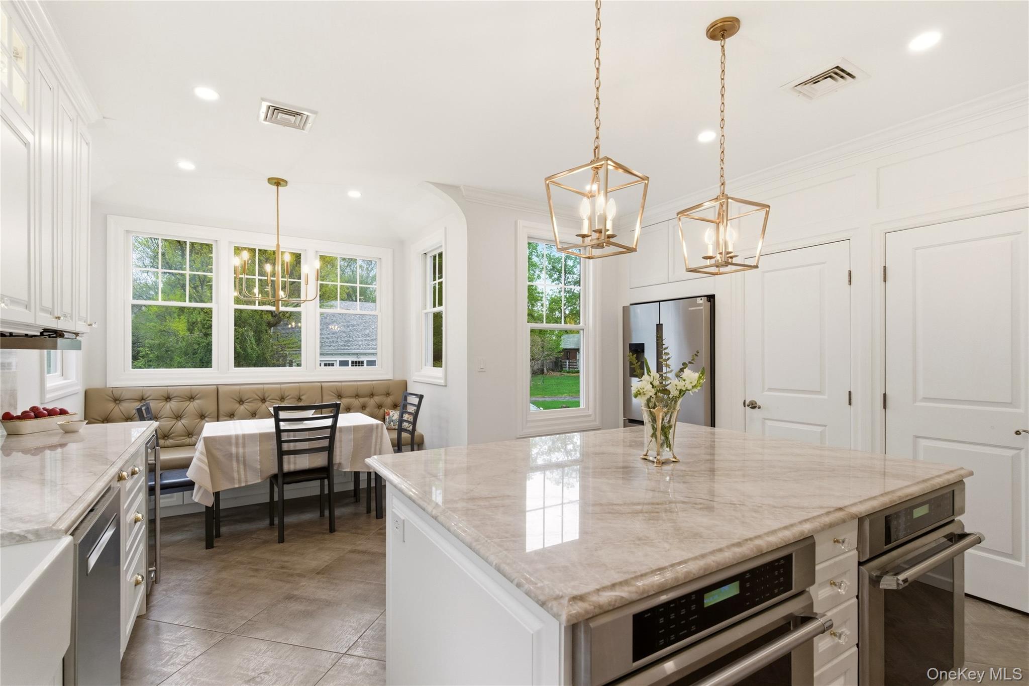 89 Duck Pond Road Glen Cove, NY 11542 - Photo 17 of 37 a kitchen with a counter space windows and appliances