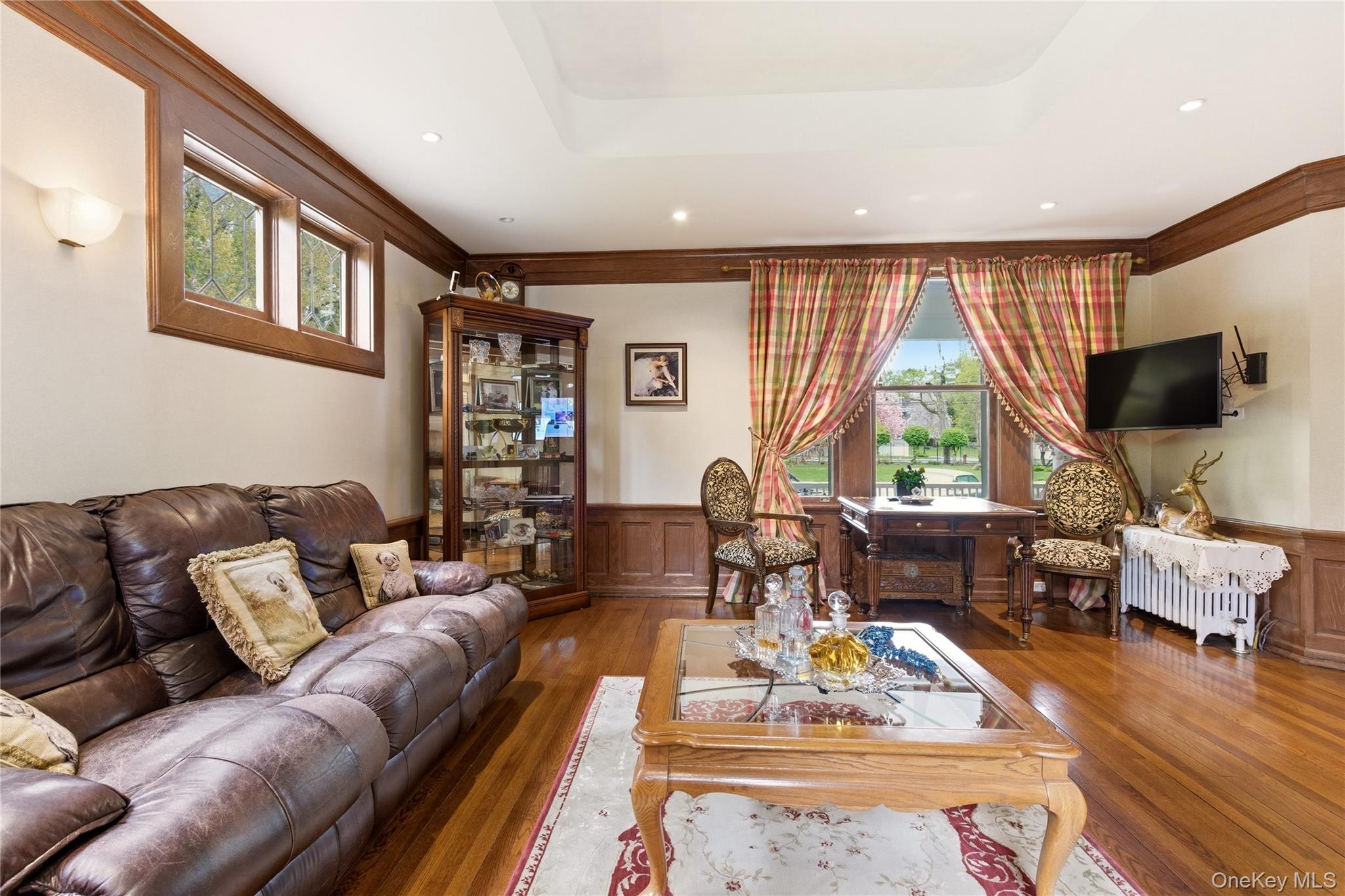 89 Duck Pond Road Glen Cove, NY 11542 - Photo 19 of 37 a living room with furniture and a flat screen tv