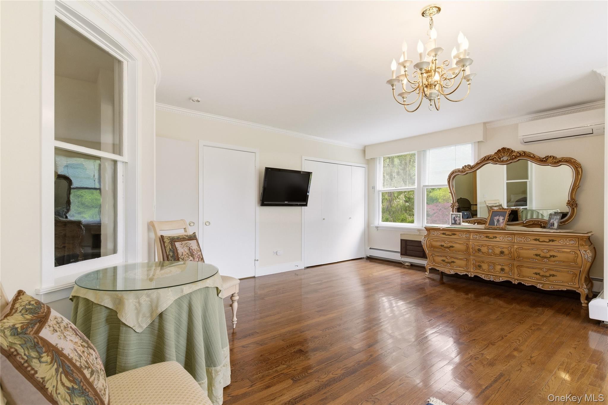 89 Duck Pond Road Glen Cove, NY 11542 - Photo 22 of 37 a living room with furniture and a flat screen tv