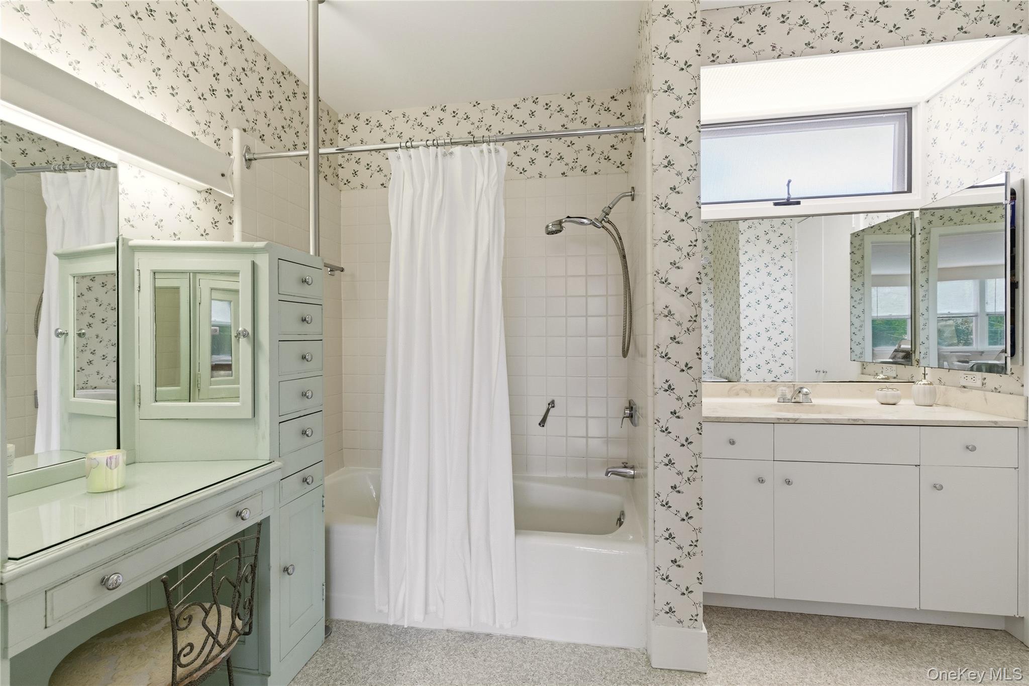 89 Duck Pond Road Glen Cove, NY 11542 - Photo 23 of 37 a bathroom with a shower sink and mirror