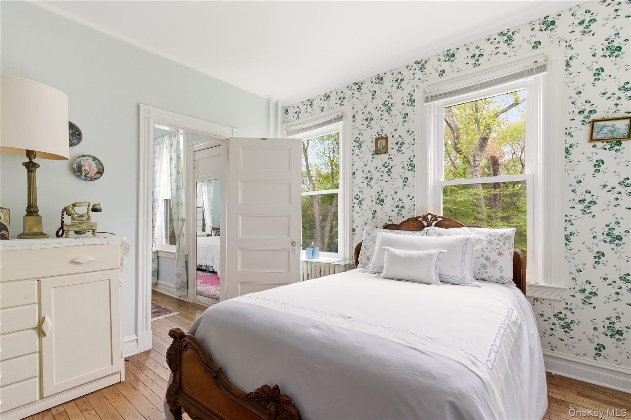89 Duck Pond Road Glen Cove, NY 11542 - Photo 25 of 37 a bedroom with a large bed and a window