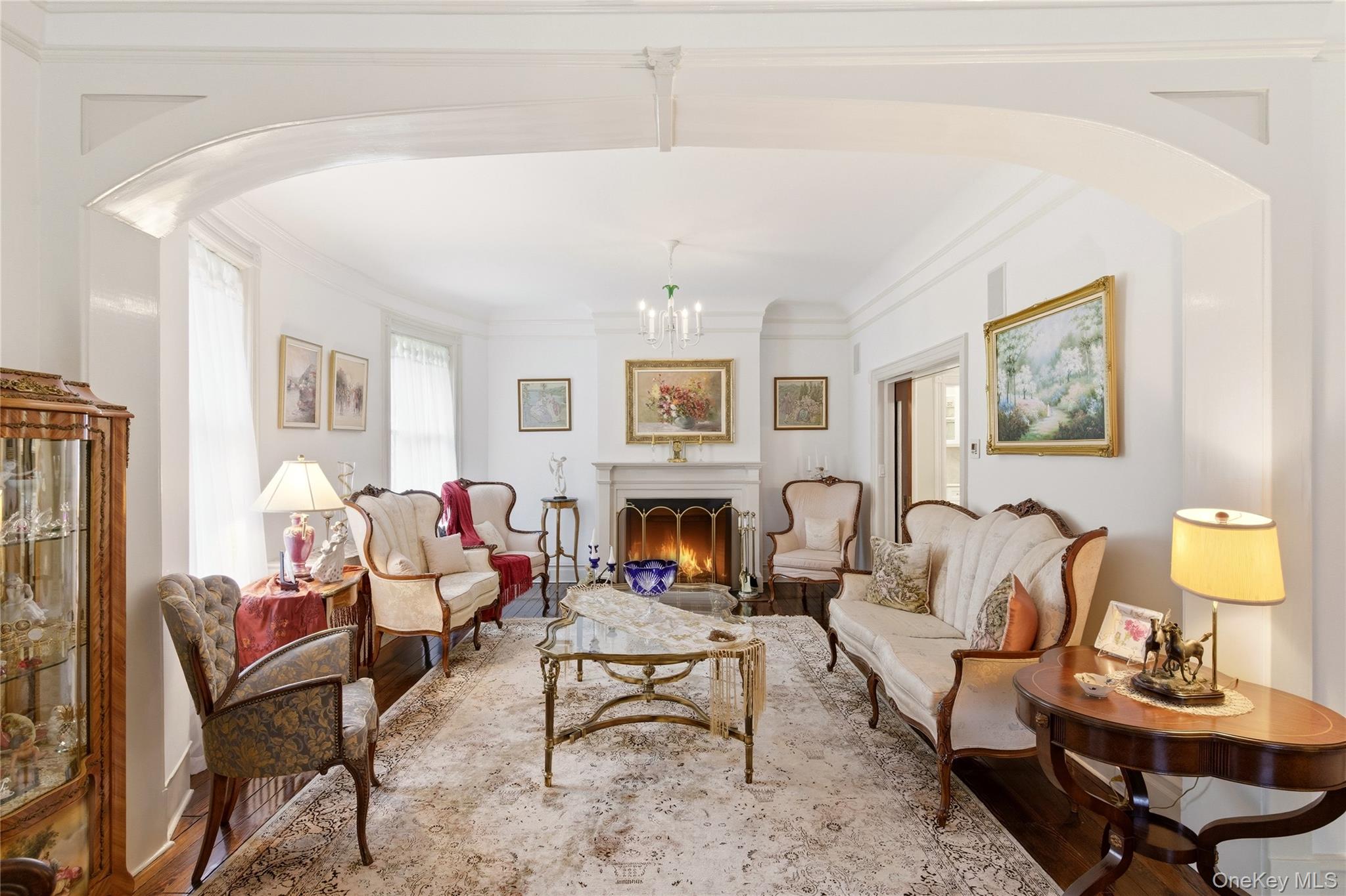 89 Duck Pond Road Glen Cove, NY 11542 - Photo 8 of 37 a living room with fireplace furniture and a fireplace