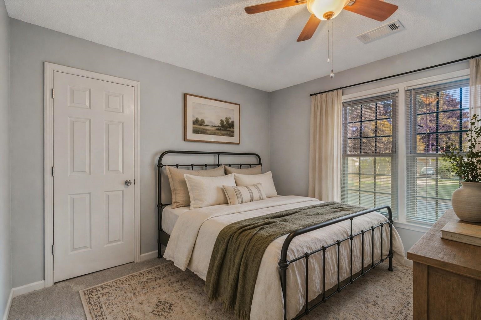 10288 Waterford Road Collierville, TN 38017 - Photo 20 of 35 Bedroom 2 (13x11) Walk-in closet and double windows offering a bright outdoor view. Virtually staged photo