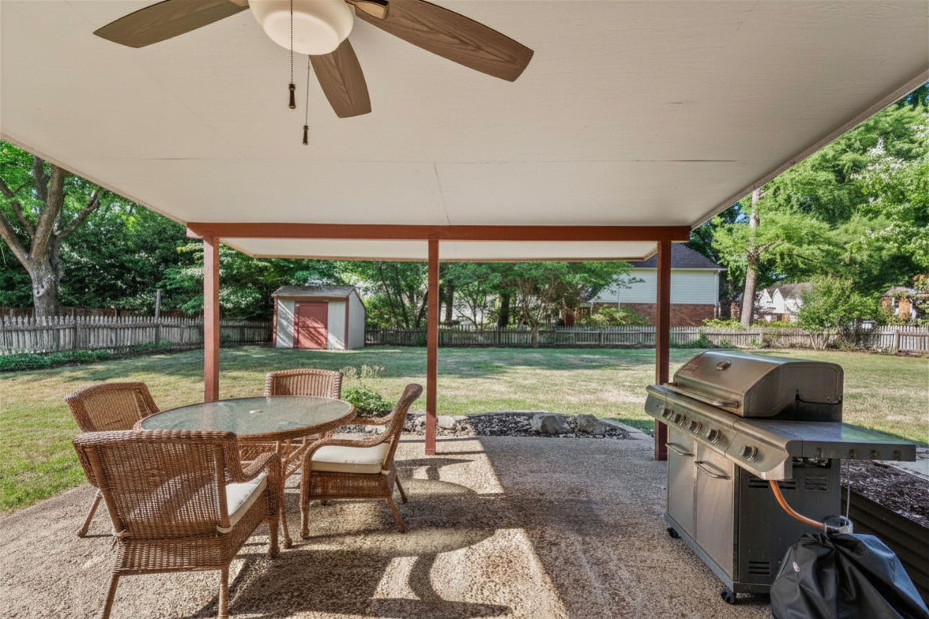 10288 Waterford Road Collierville, TN 38017 - Photo 27 of 35 A relaxing outdoor haven, perfect for entertaining or unwinding. There is also a Tuff Shed for extra storage in back yard. Virtually staged photo