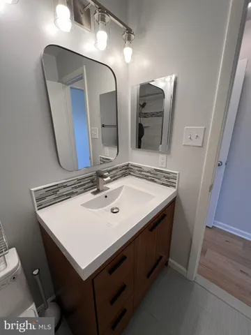 a bathroom with a shower a toilet and sink