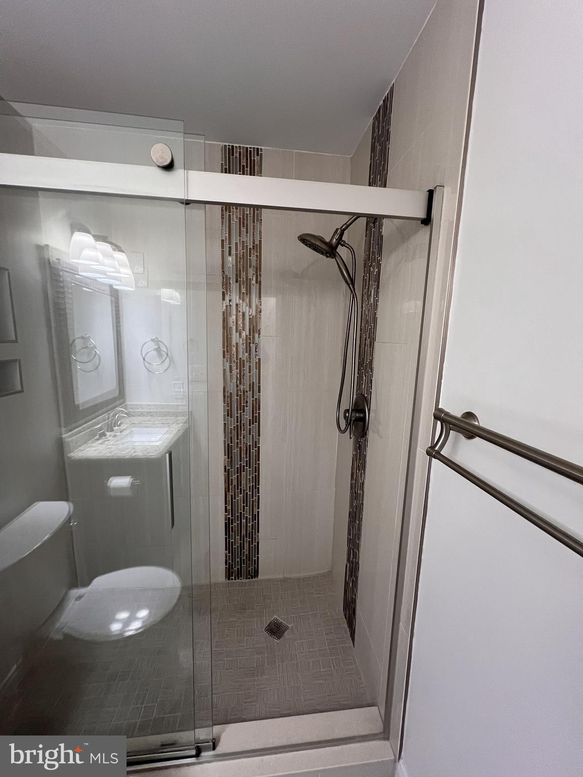 5355 Smooth Meadow Way, Unit 5 Columbia, MD 21044 - Photo 16 of 27 a bathroom with a shower a toilet and sink