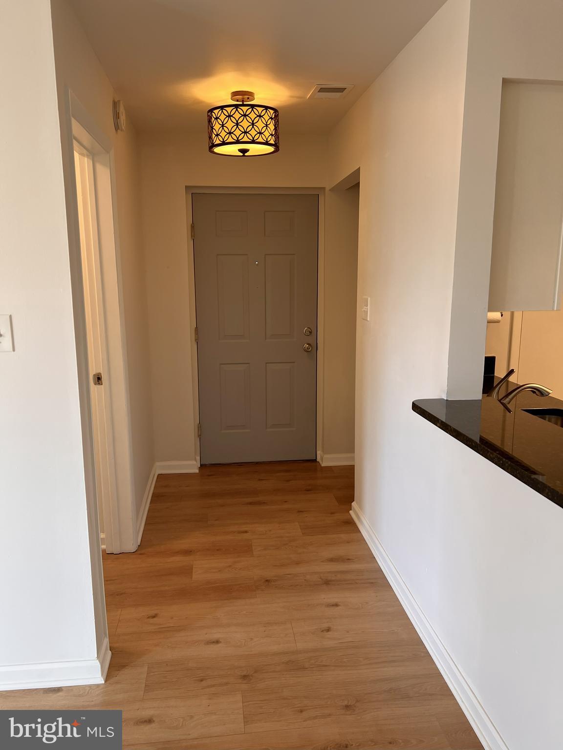 5355 Smooth Meadow Way, Unit 5 Columbia, MD 21044 - Photo 24 of 27 a view of a hallway with wooden floor