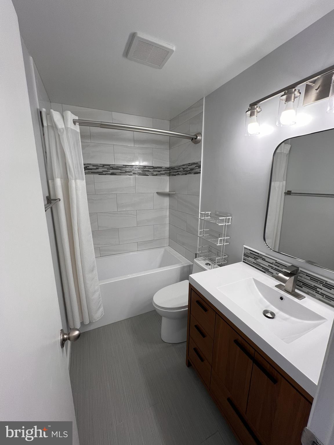 5355 Smooth Meadow Way, Unit 5 Columbia, MD 21044 - Photo 6 of 27 a bathroom with a sink a toilet and shower