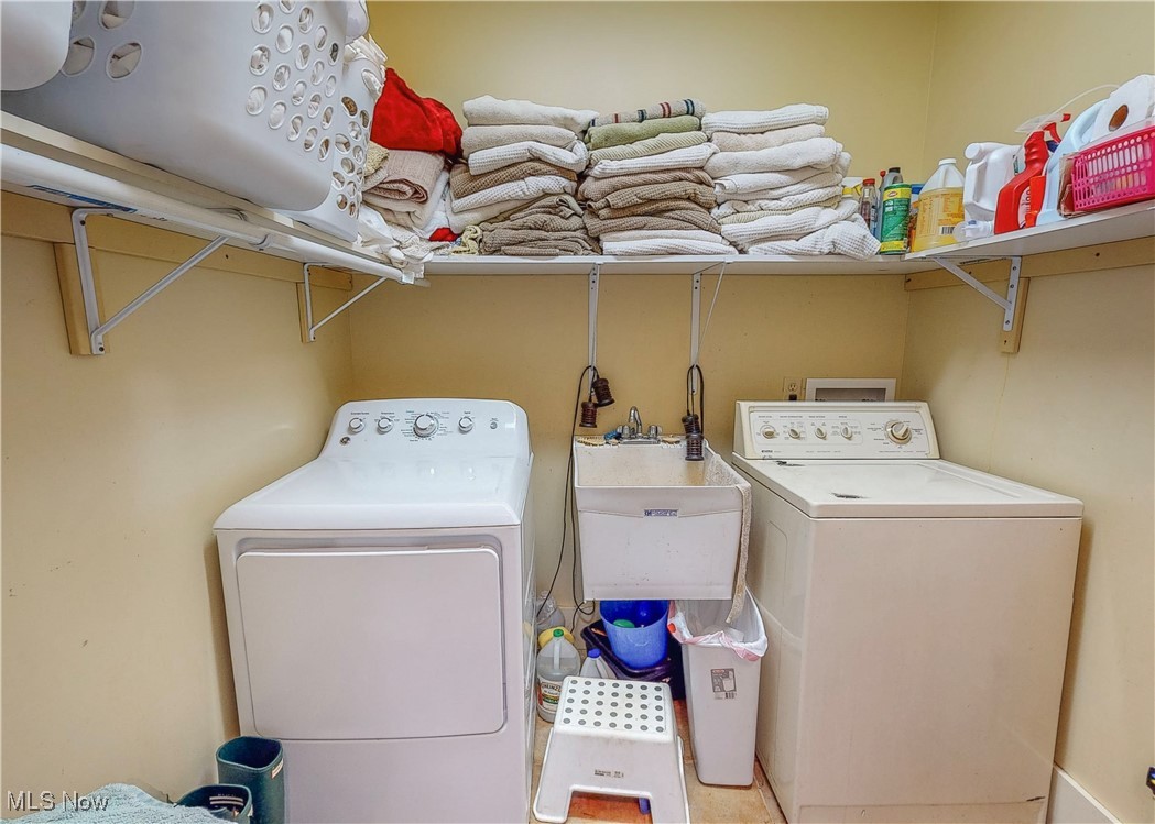 5696 Steubenville Road Southeast Amsterdam, OH 43903 - Photo 38 of 50 Laundry area with washer and dryer and sink
