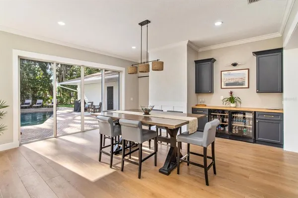 a view of a dining room with furniture window and outside view