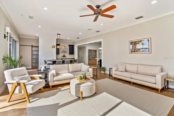a living room with furniture and white walls