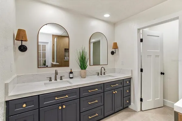 a bathroom with double vanity sinks and a vanity