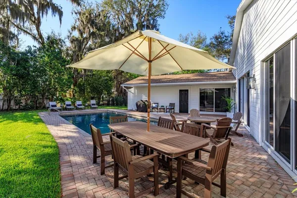 a patio with table and chairs