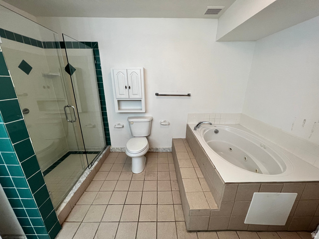 3013 North 100 West Provo, UT 84604 - Photo 10 of 18 Full bathroom featuring a stall shower, light tile patterned flooring, and a jetted tub