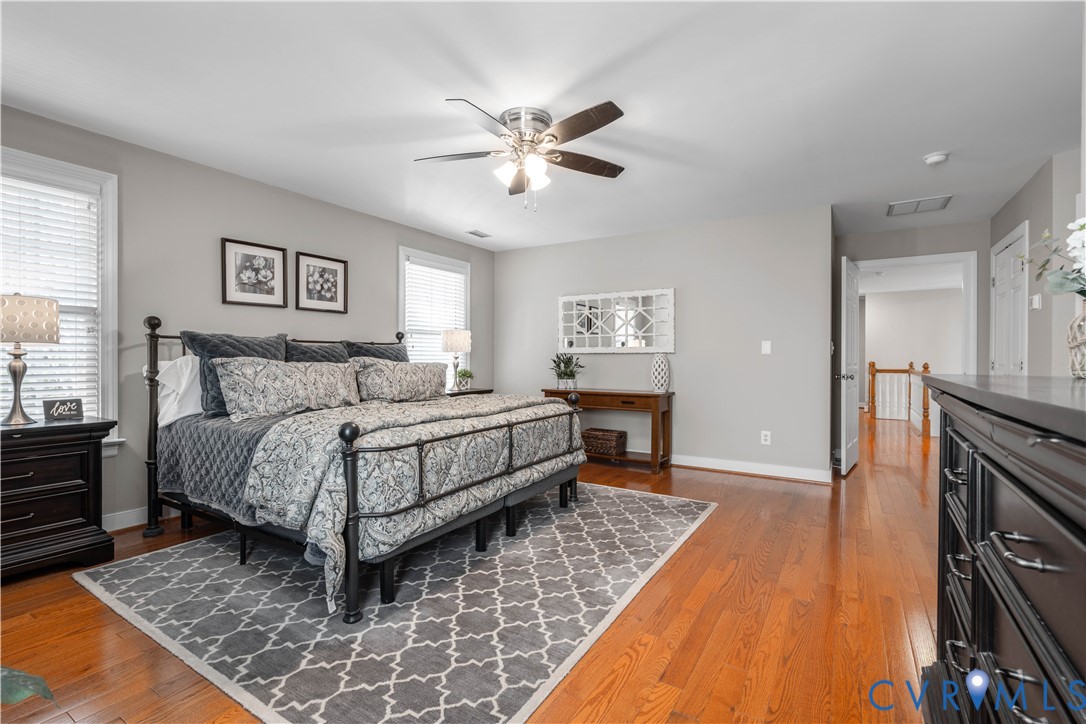 638 Cross Ridge Lane Manakin-Sabot, VA 23103 - Photo 24 of 54 a bedroom with a bed and a chandelier