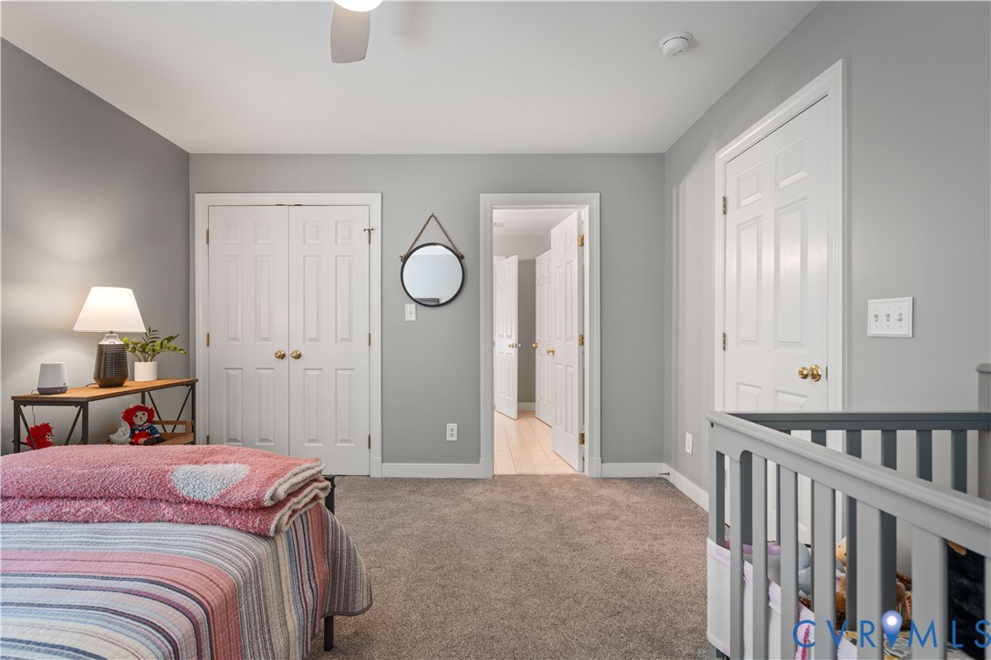 638 Cross Ridge Lane Manakin-Sabot, VA 23103 - Photo 30 of 54 a bed room with a bed and a lamp