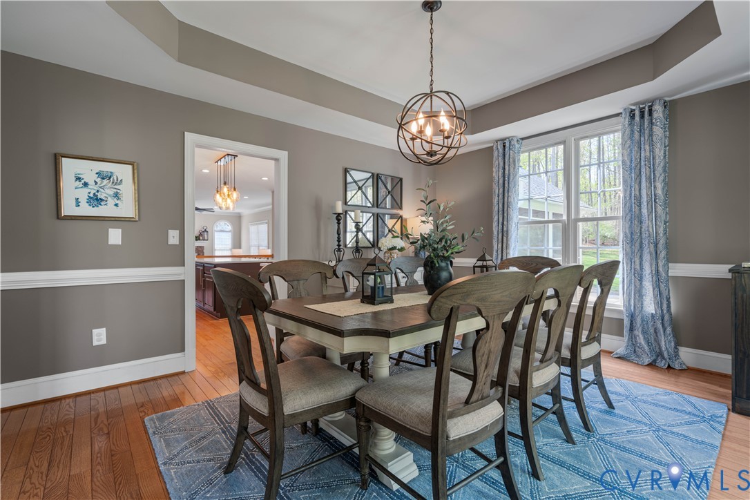 638 Cross Ridge Lane Manakin-Sabot, VA 23103 - Photo 9 of 54 a view of a dining room with furniture a chandelier and wooden floor
