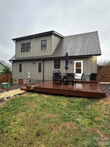 a front view of a house with patio and garden