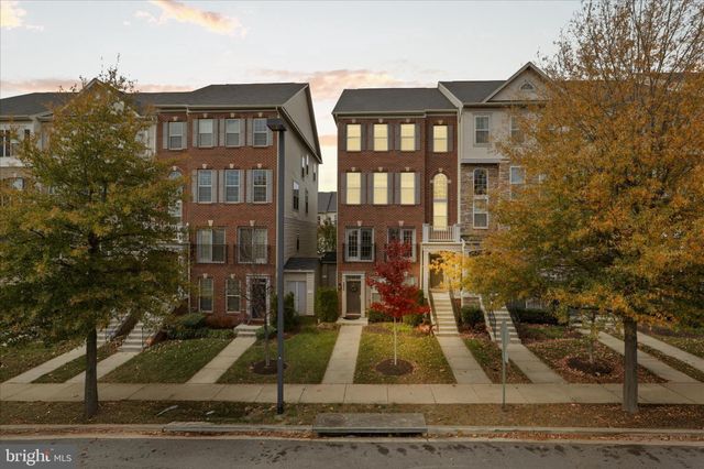 a view of a brick building next to a yard