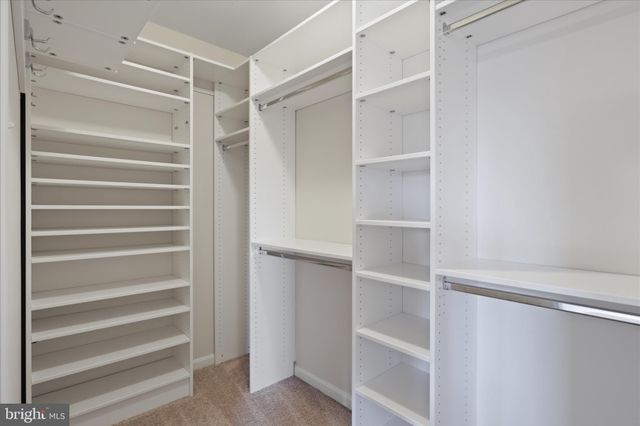 a bathroom with a shower sink and mirror