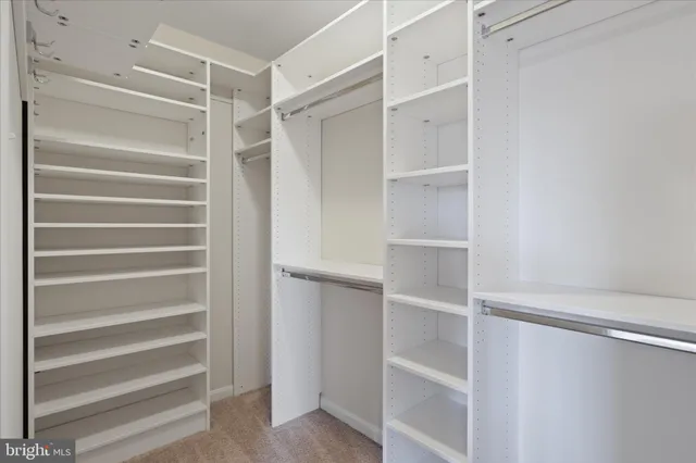 a bathroom with a shower sink and mirror