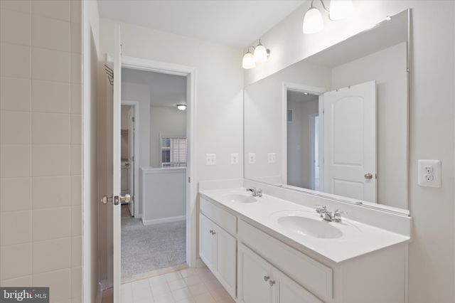 a view of a building with sitting area and furniture