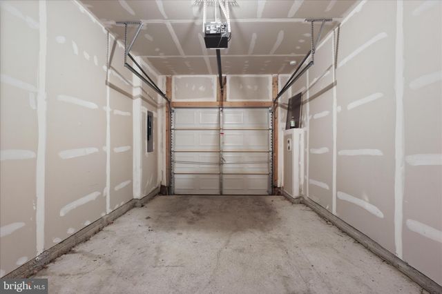 a view of house with outdoor space and sitting area