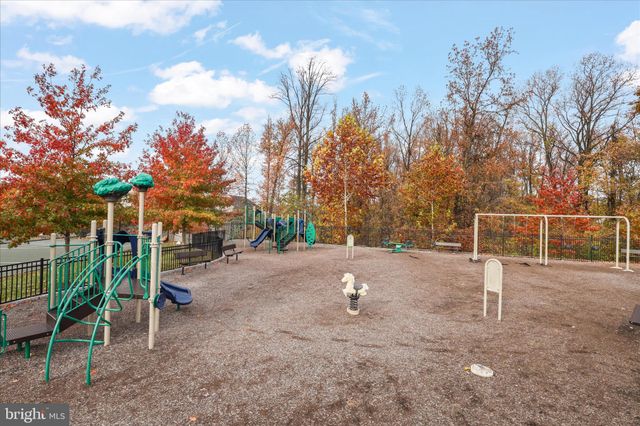 a childrens park with lots of swings and slides