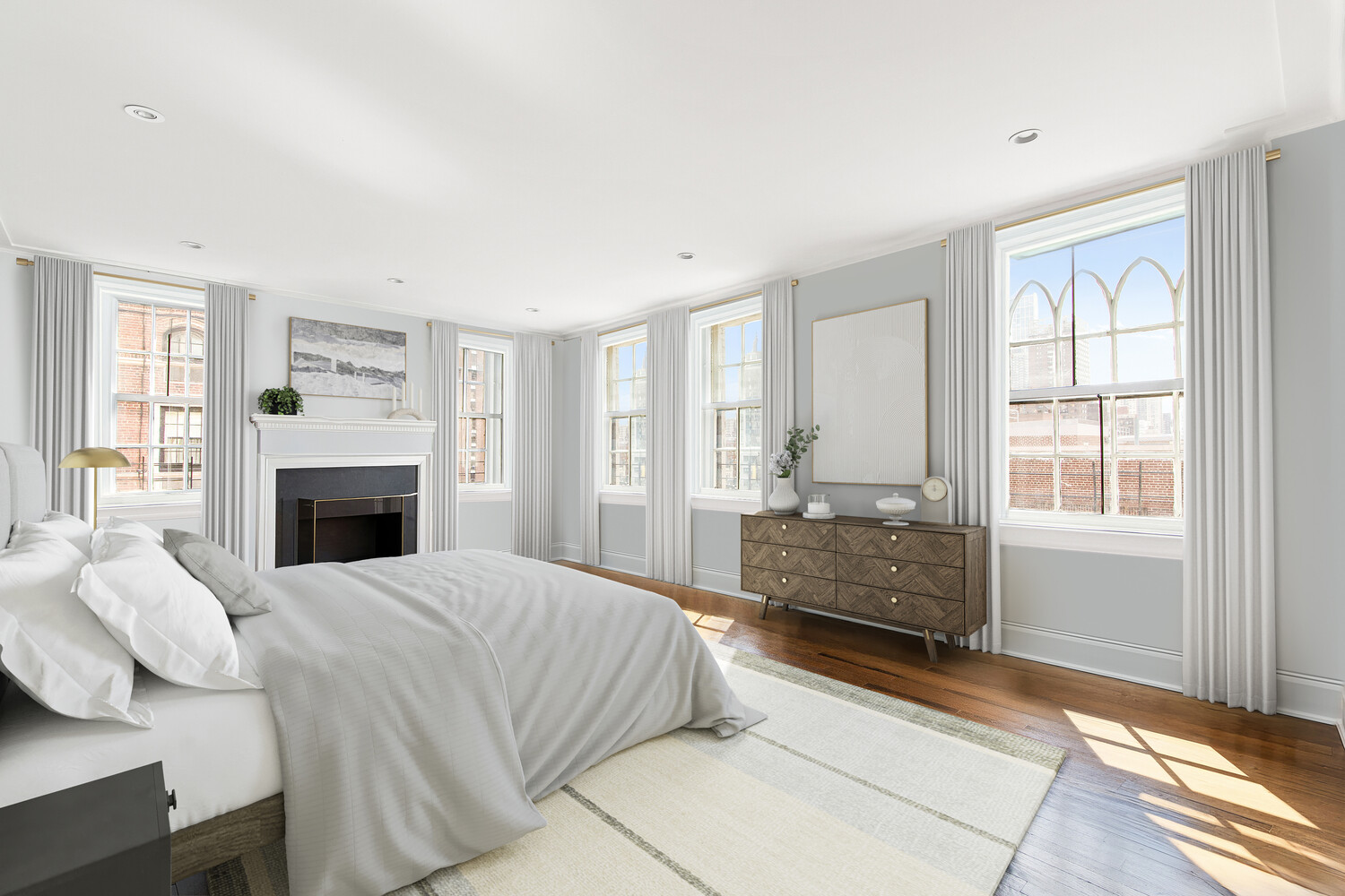 333 East 68th Street, Unit PHC Manhattan, NY 10065 - Photo 8 of 24 a bedroom with a bed and a fireplace