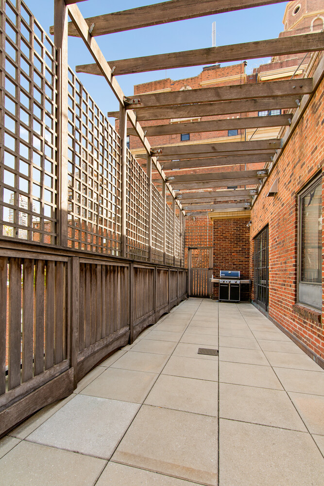 333 East 68th Street, Unit PHC Manhattan, NY 10065 - Photo 18 of 24 a view of a porch with wooden floor