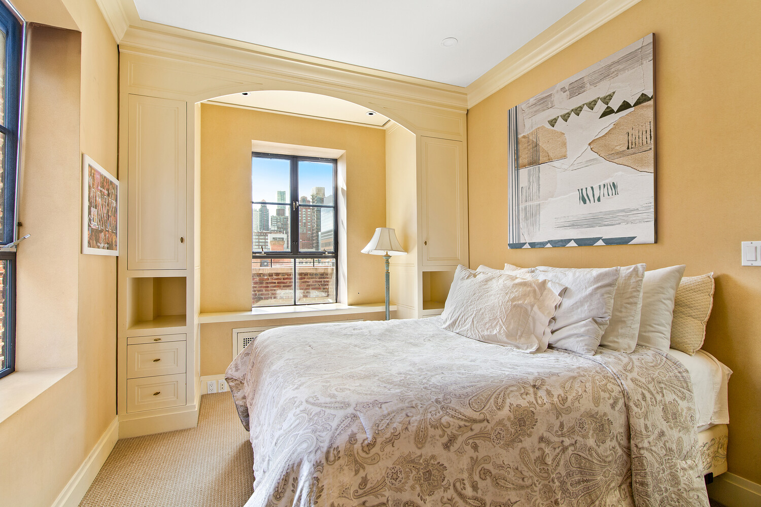 333 East 68th Street, Unit PHC Manhattan, NY 10065 - Photo 20 of 24 a bedroom with a bed and a window