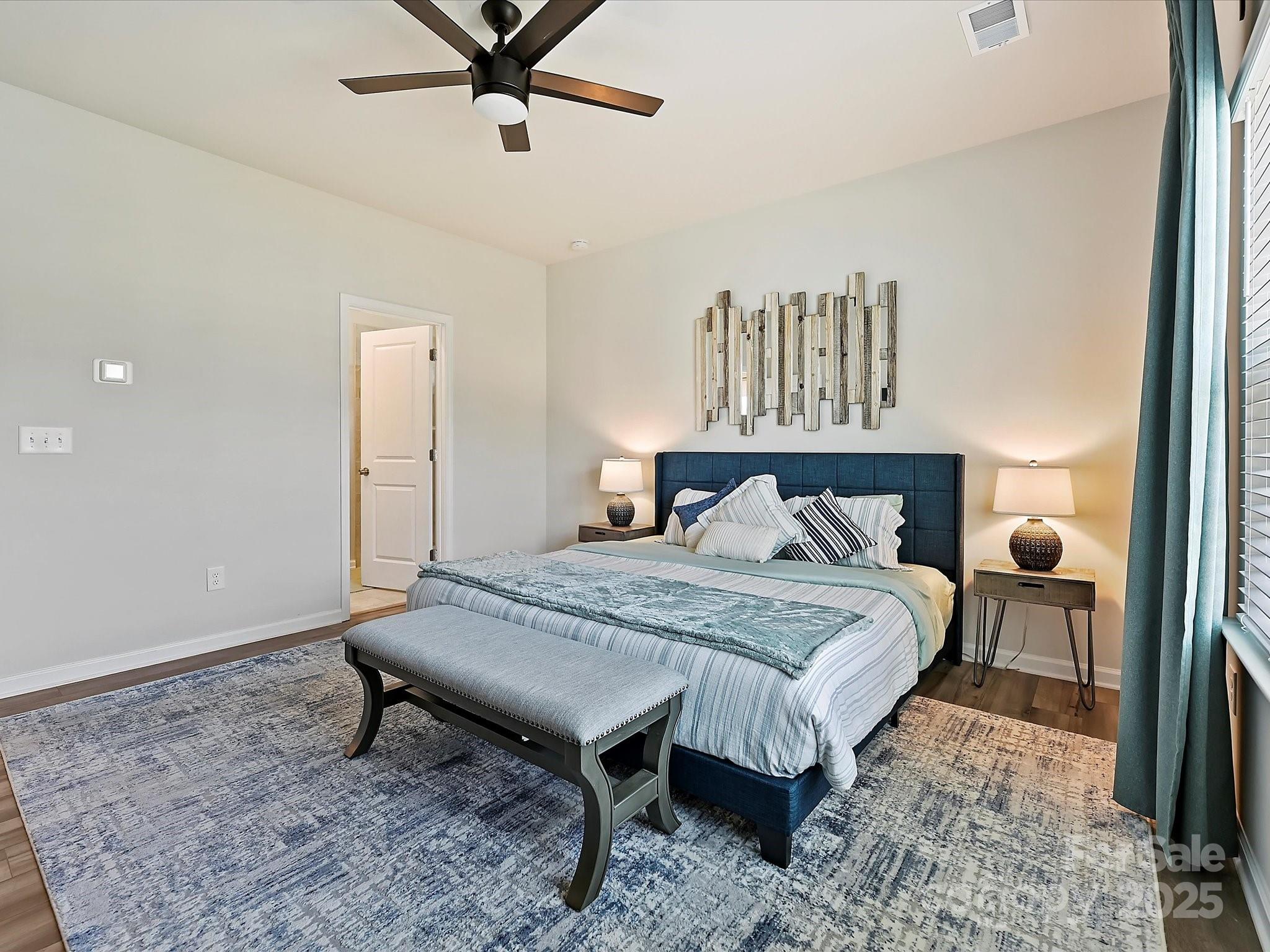 5807 Soft Shell Drive Lancaster, SC 29720 - Photo 12 of 33 a bedroom with a bed and ceiling fan