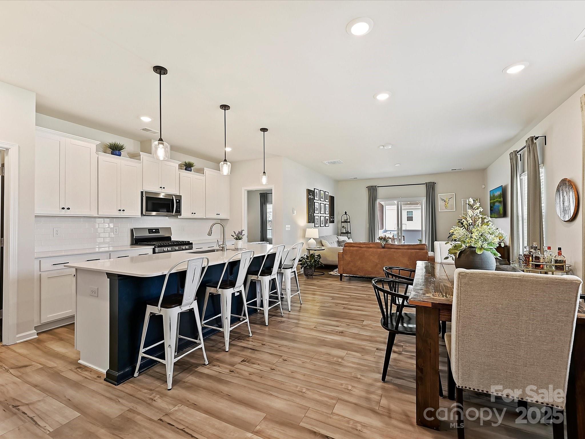5807 Soft Shell Drive Lancaster, SC 29720 - Photo 3 of 33 a large kitchen with a table and chairs in it
