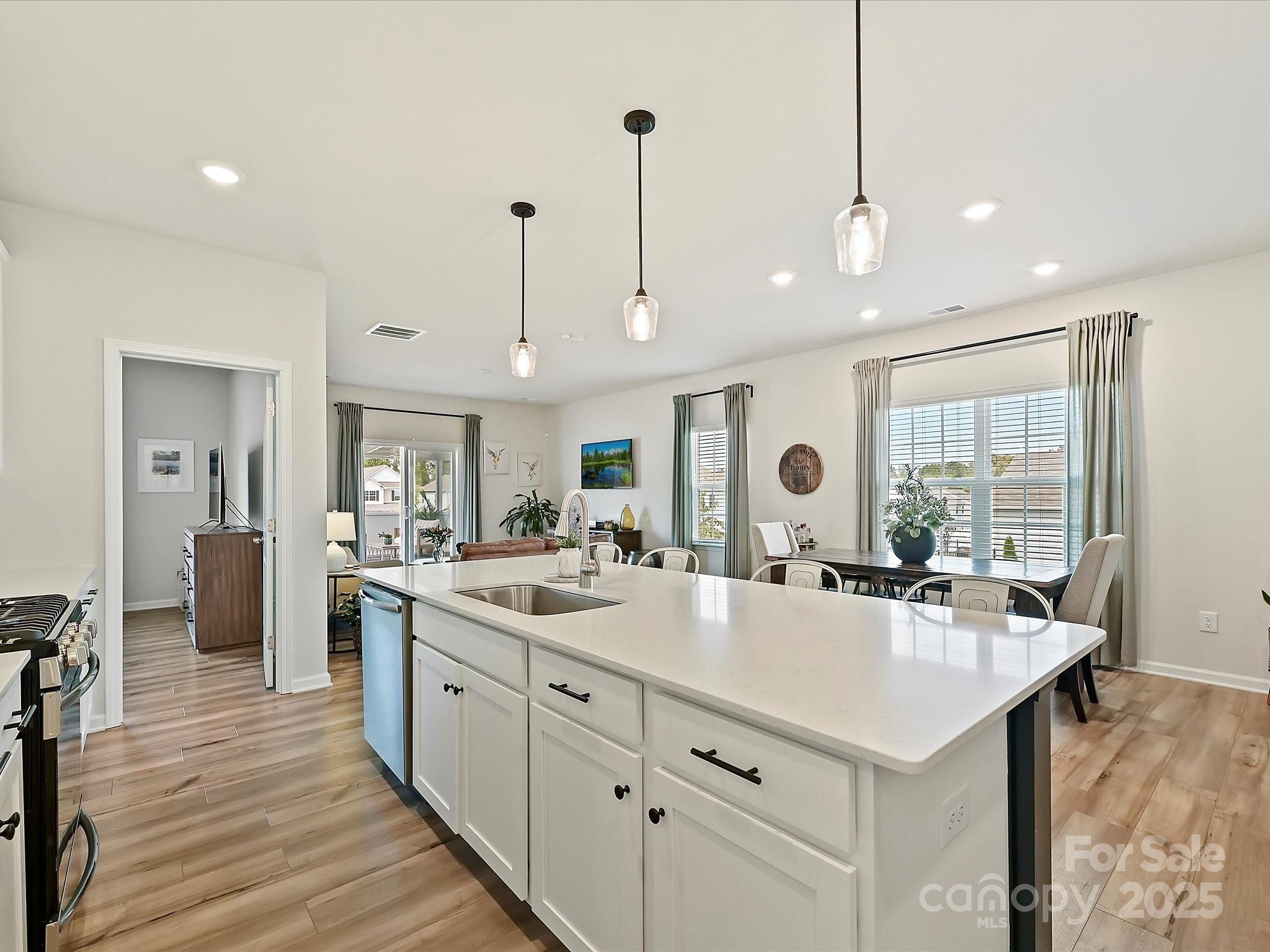 5807 Soft Shell Drive Lancaster, SC 29720 - Photo 5 of 33 a large kitchen with kitchen island a sink appliances and a counter top space