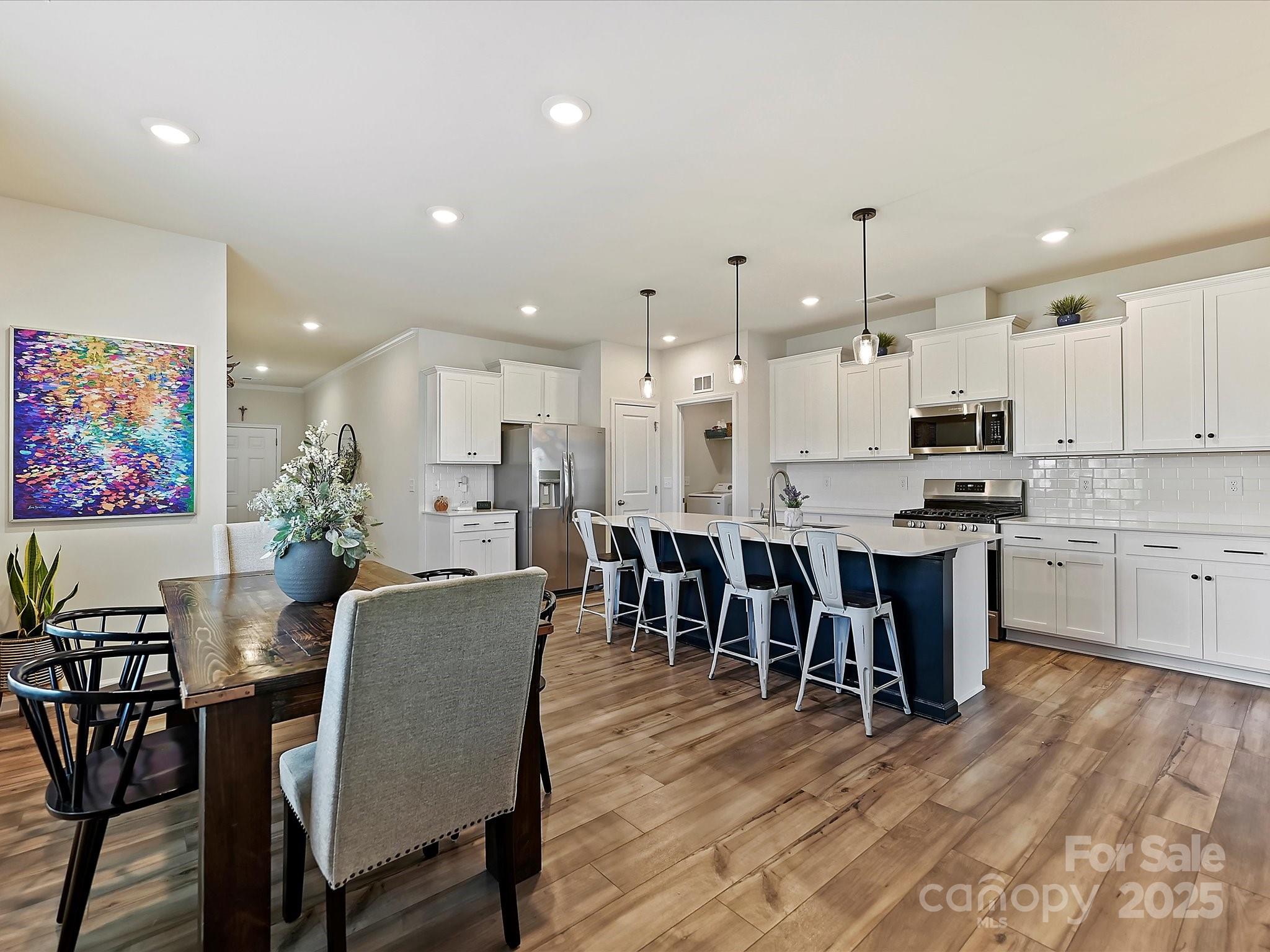 5807 Soft Shell Drive Lancaster, SC 29720 - Photo 9 of 33 a large kitchen with cabinets table and chairs