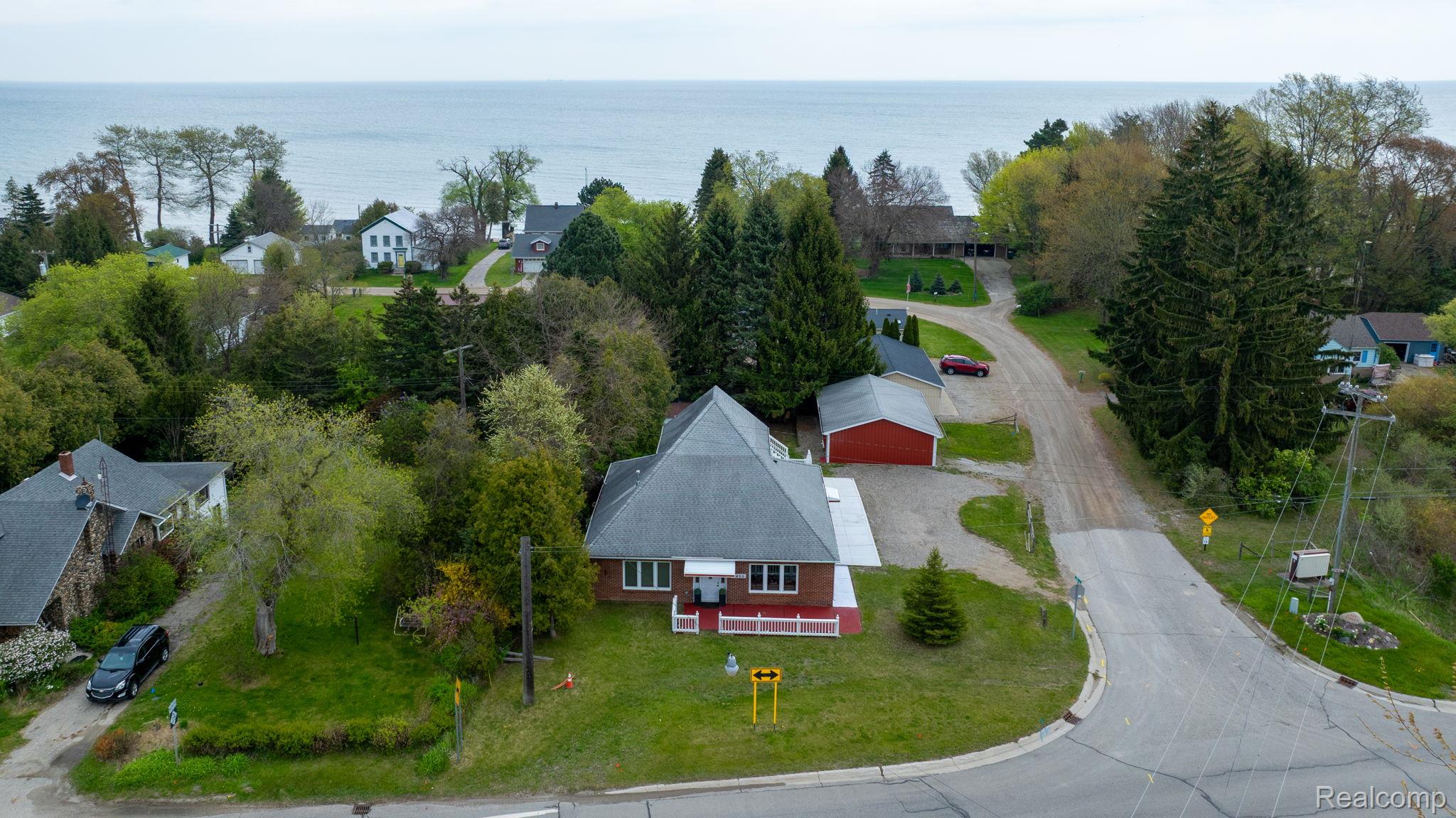 2400 North Lakeshore Road Carsonville, MI 48419 - Photo 32 of 33 Aerial view of residential area with a nearby body of water
