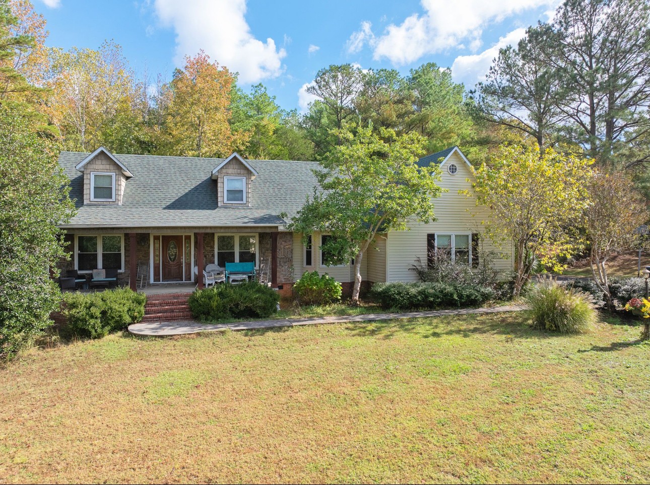 a front view of a house with a yard