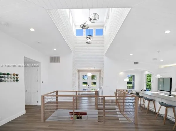 a view of a livingroom with furniture and hardwood floor