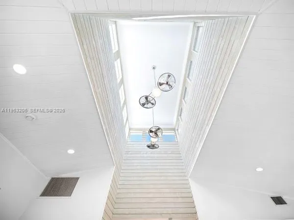 a living room with furniture and windows