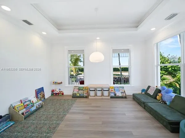 a bedroom with a large bed and a large window