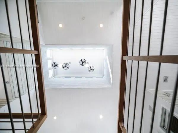 a bedroom with a large bed and a large window